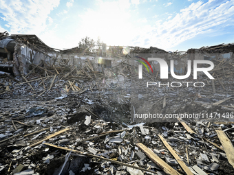 The crater from a Russian FAB-500 bomb, which destroyed the Myrnohrad Infectious Diseases Hospital on July 27, 2024, is being seen in the gr...