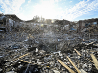 The crater from a Russian FAB-500 bomb, which destroyed the Myrnohrad Infectious Diseases Hospital on July 27, 2024, is being seen in the gr...