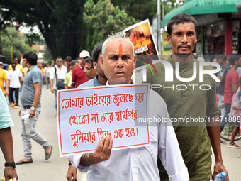 People from the Hindu community are taking part in a protest rally against the problems of the Hindu community in Bangladesh due to the unre...