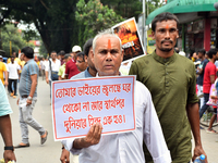 People from the Hindu community are taking part in a protest rally against the problems of the Hindu community in Bangladesh due to the unre...