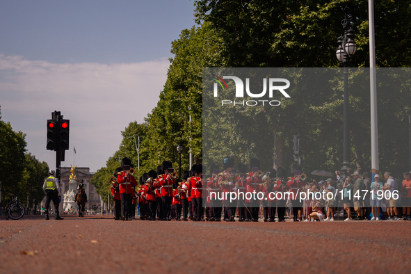 The Royal Guards are marching under the sun, as the capital is being hit by a heatwave which is set to bring the temperatures to 35C, in Lon...