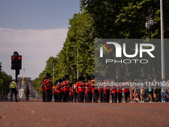 The Royal Guards are marching under the sun, as the capital is being hit by a heatwave which is set to bring the temperatures to 35C, in Lon...