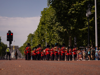 The Royal Guards are marching under the sun, as the capital is being hit by a heatwave which is set to bring the temperatures to 35C, in Lon...