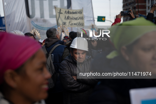 Pilgrims and workers are taking part in a march from the sanctuary at the San Cayetano Church to Plaza de Mayo Square in Buenos Aires, Argen...