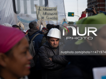 Pilgrims and workers are taking part in a march from the sanctuary at the San Cayetano Church to Plaza de Mayo Square in Buenos Aires, Argen...