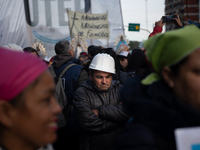 Pilgrims and workers are taking part in a march from the sanctuary at the San Cayetano Church to Plaza de Mayo Square in Buenos Aires, Argen...