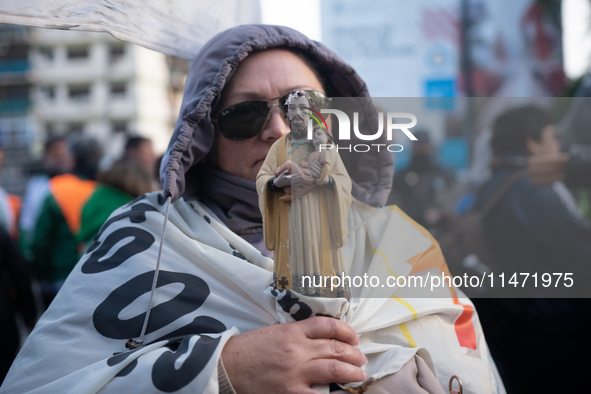 Pilgrims and workers are taking part in a march from the sanctuary at the San Cayetano Church to Plaza de Mayo Square in Buenos Aires, Argen...