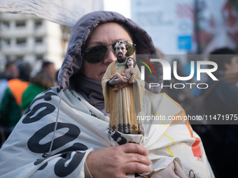 Pilgrims and workers are taking part in a march from the sanctuary at the San Cayetano Church to Plaza de Mayo Square in Buenos Aires, Argen...