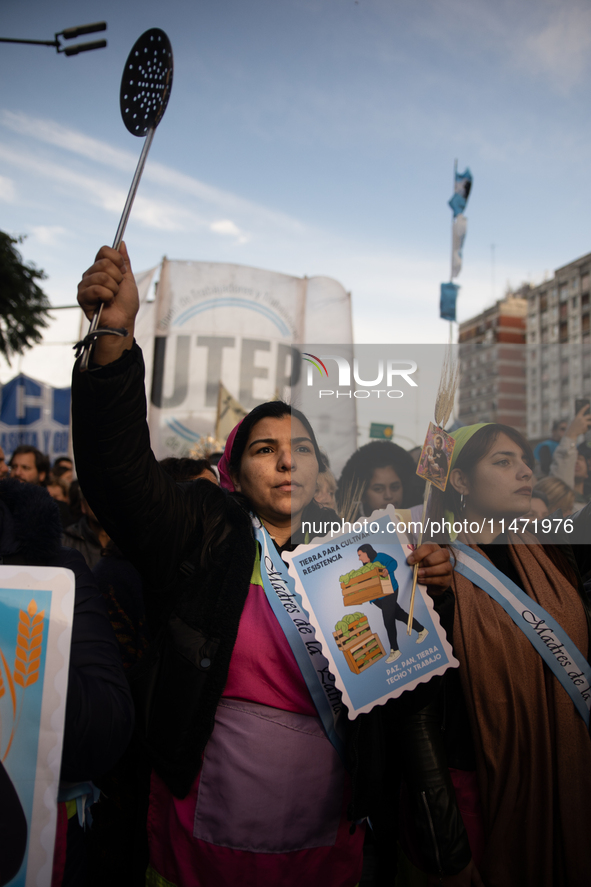 Pilgrims and workers are taking part in a march from the sanctuary at the San Cayetano Church to Plaza de Mayo Square in Buenos Aires, Argen...