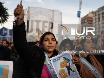 Pilgrims and workers are taking part in a march from the sanctuary at the San Cayetano Church to Plaza de Mayo Square in Buenos Aires, Argen...