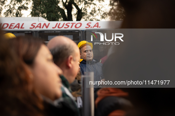 Pilgrims and workers are taking part in a march from the sanctuary at the San Cayetano Church to Plaza de Mayo Square in Buenos Aires, Argen...