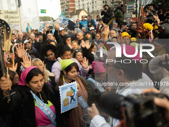 Pilgrims and workers are taking part in a march from the sanctuary at the San Cayetano Church to Plaza de Mayo Square in Buenos Aires, Argen...