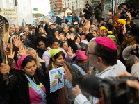 Pilgrims and workers are taking part in a march from the sanctuary at the San Cayetano Church to Plaza de Mayo Square in Buenos Aires, Argen...