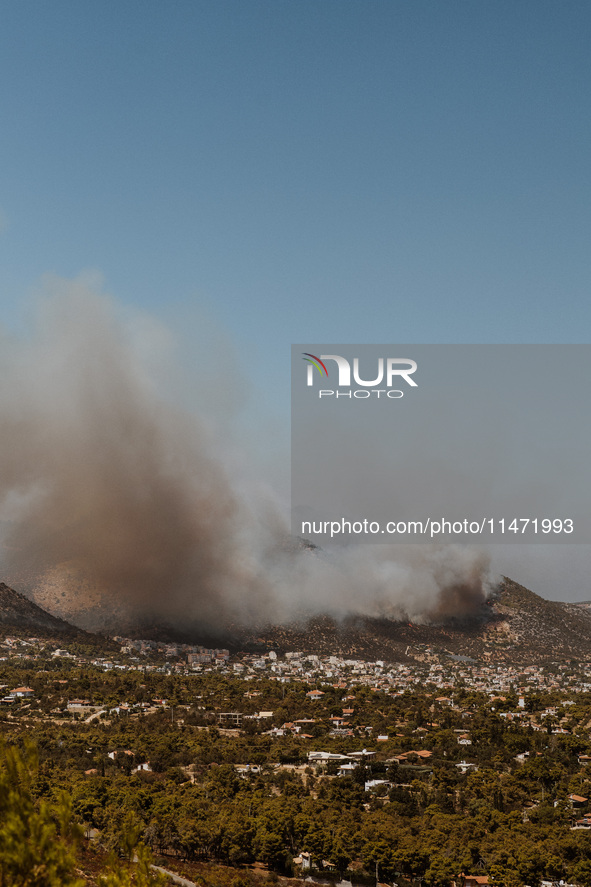 Severe wildfires are erupting across Attica, Greece, fueled by extreme heat, drought, and high winds in Neos Voutzas, Attica, Greece, on Aug...