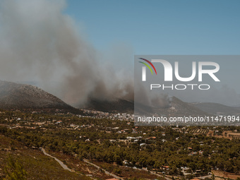 Severe wildfires are erupting across Attica, Greece, fueled by extreme heat, drought, and high winds in Neos Voutzas, Attica, Greece, on Aug...