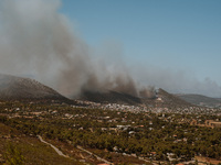 Severe wildfires are erupting across Attica, Greece, fueled by extreme heat, drought, and high winds in Neos Voutzas, Attica, Greece, on Aug...