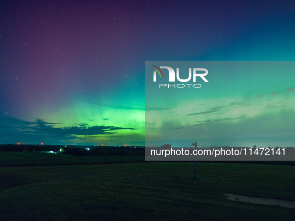 Wisconsin's night sky is glowing with the Northern Lights, as a geomagnetic storm is bringing vibrant pink and green colors, stealing the sp...