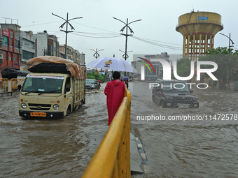 Vehicles are moving through the waterlogged Sikar Road following heavy monsoon rains in Jaipur, Rajasthan, India, on Monday, August 12, 2024...