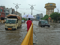 Vehicles are moving through the waterlogged Sikar Road following heavy monsoon rains in Jaipur, Rajasthan, India, on Monday, August 12, 2024...