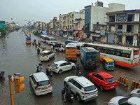 Vehicles are moving through the waterlogged Sikar Road following heavy monsoon rains in Jaipur, Rajasthan, India, on Monday, August 12, 2024...