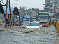 Vehicles are moving through the waterlogged Sikar Road following heavy monsoon rains in Jaipur, Rajasthan, India, on Monday, August 12, 2024...