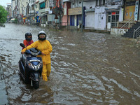 Vehicles are moving through the waterlogged Sikar Road following heavy monsoon rains in Jaipur, Rajasthan, India, on Monday, August 12, 2024...