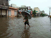 Locals are at waterlogged Sikar Road following heavy monsoon rains, in Jaipur, Rajasthan, India, on August 12, 2024. (