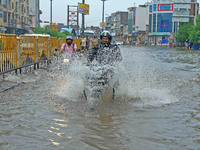 Vehicles are moving through the waterlogged Sikar Road following heavy monsoon rains in Jaipur, India, on August 12, 2024. (