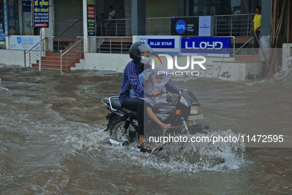 Vehicles are moving through the waterlogged Sikar Road following heavy monsoon rains in Jaipur, Rajasthan, India, on Monday, August 12, 2024...