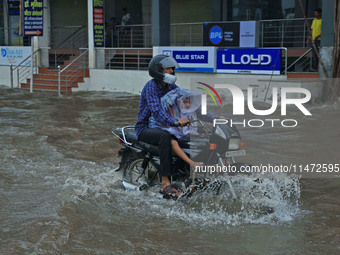 Vehicles are moving through the waterlogged Sikar Road following heavy monsoon rains in Jaipur, Rajasthan, India, on Monday, August 12, 2024...