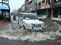 Vehicles are moving through the waterlogged Sikar Road following heavy monsoon rains in Jaipur, Rajasthan, India, on Monday, August 12, 2024...