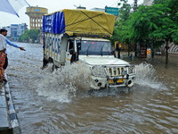 Vehicles are moving through the waterlogged Sikar Road following heavy monsoon rains in Jaipur, Rajasthan, India, on Monday, August 12, 2024...