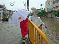 Locals are at waterlogged Sikar Road following heavy monsoon rains, in Jaipur, Rajasthan, India, on August 12, 2024. (