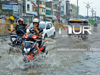 Vehicles are moving through the waterlogged Sikar Road following heavy monsoon rains in Jaipur, Rajasthan, India, on Monday, August 12, 2024...