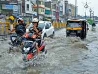 Vehicles are moving through the waterlogged Sikar Road following heavy monsoon rains in Jaipur, Rajasthan, India, on Monday, August 12, 2024...