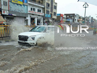 Vehicles are moving through the waterlogged Sikar Road following heavy monsoon rains in Jaipur, Rajasthan, India, on Monday, August 12, 2024...