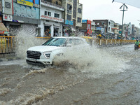 Vehicles are moving through the waterlogged Sikar Road following heavy monsoon rains in Jaipur, Rajasthan, India, on Monday, August 12, 2024...