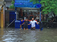 Locals are at waterlogged Sikar Road following heavy monsoon rains, in Jaipur, Rajasthan, India, on August 12, 2024. (