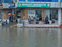 Locals are at waterlogged Sikar Road following heavy monsoon rains, in Jaipur, Rajasthan, India, on August 12, 2024. (