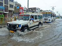 Vehicles are moving through the waterlogged Sikar Road following heavy monsoon rains in Jaipur, Rajasthan, India, on Monday, August 12, 2024...