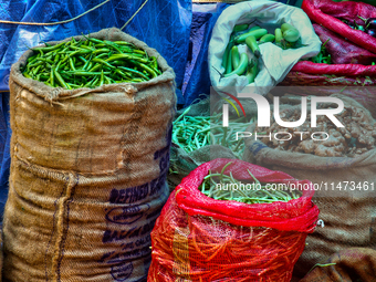 Sacks are being filled with vegetables at the Chalai market in Thiruvananthapuram, Kerala, India, on April 13, 2024. The Chalai Market (Chal...