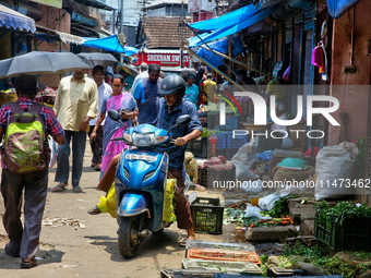 People are purchasing fruits and vegetables at the Chalai market in Thiruvananthapuram, Kerala, India, on April 13, 2024. The Chalai Market...