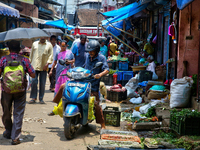 People are purchasing fruits and vegetables at the Chalai market in Thiruvananthapuram, Kerala, India, on April 13, 2024. The Chalai Market...