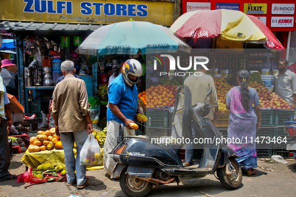 People are purchasing fruits and vegetables at the Chalai market in Thiruvananthapuram, Kerala, India, on April 13, 2024. The Chalai Market...