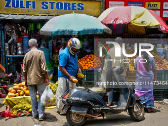 People are purchasing fruits and vegetables at the Chalai market in Thiruvananthapuram, Kerala, India, on April 13, 2024. The Chalai Market...