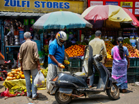 People are purchasing fruits and vegetables at the Chalai market in Thiruvananthapuram, Kerala, India, on April 13, 2024. The Chalai Market...