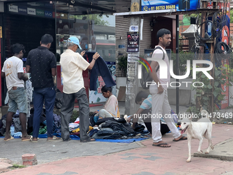 People are purchasing jeans that are being sold along the footpath in Thiruvananthapuram (Trivandrum), Kerala, India, on April 14, 2024. (