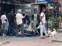 People are purchasing jeans that are being sold along the footpath in Thiruvananthapuram (Trivandrum), Kerala, India, on April 14, 2024. (