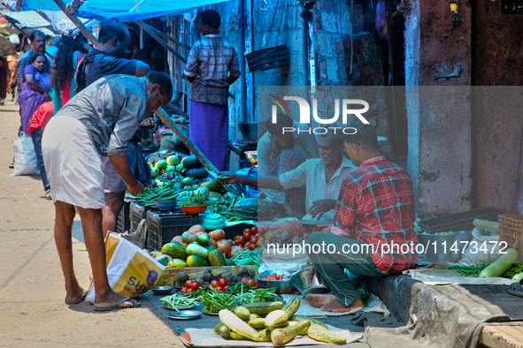 A man is purchasing vegetables at the Chalai market in Thiruvananthapuram, Kerala, India, on April 13, 2024. The Chalai Market (Chalai bazaa...