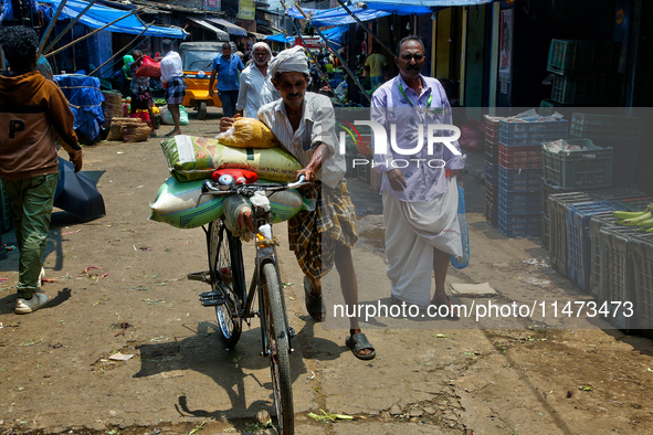 A busy street is bustling at the Chalai market in Thiruvananthapuram (Trivandrum), Kerala, India, on April 13, 2024. The Chalai Market (Chal...